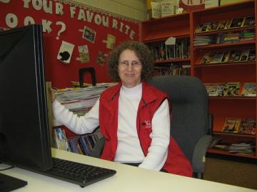 Linda Aksomitis volunteering in the library
